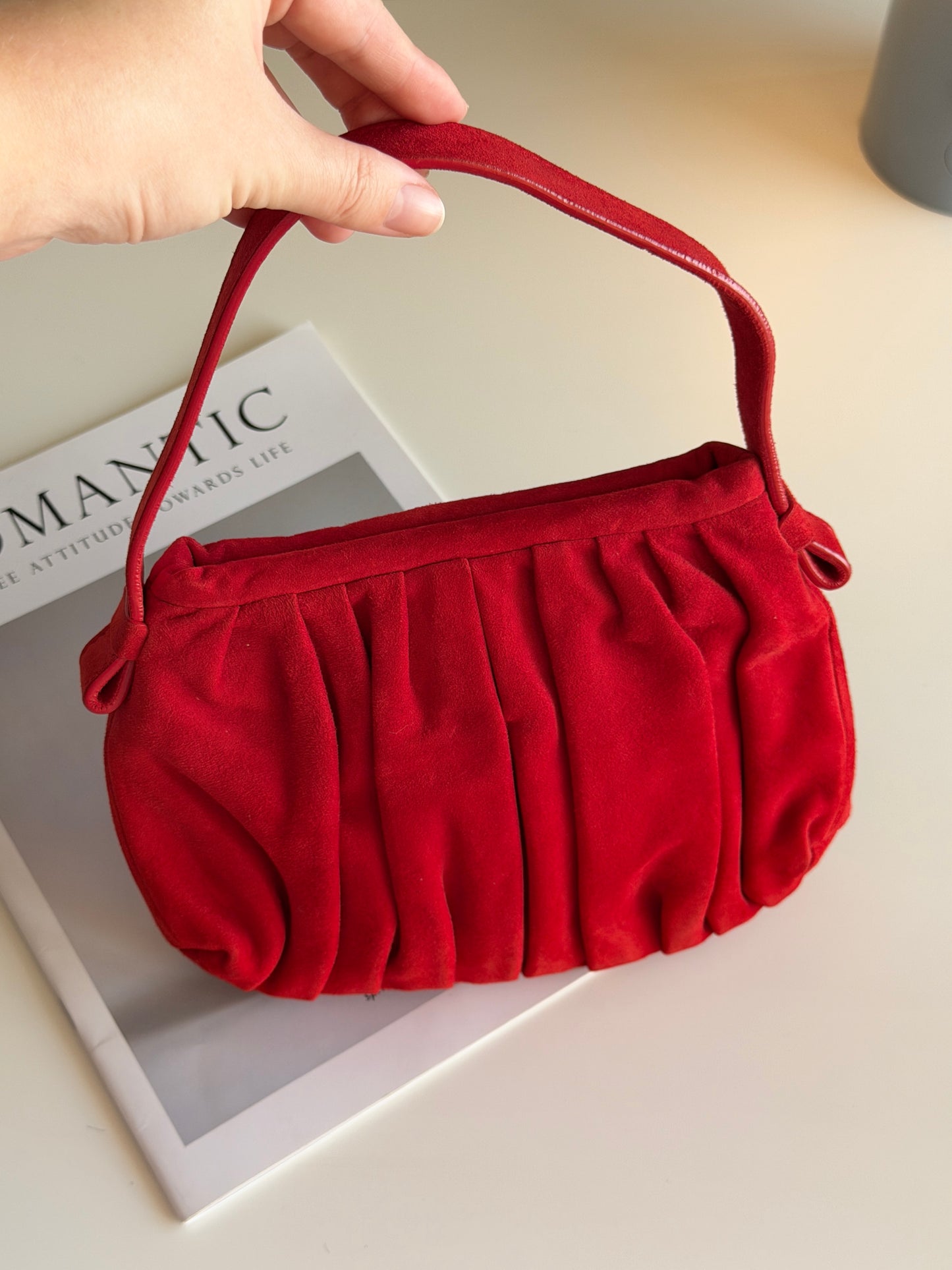 Vibrant red bag crafted from soft suede by Hobbs