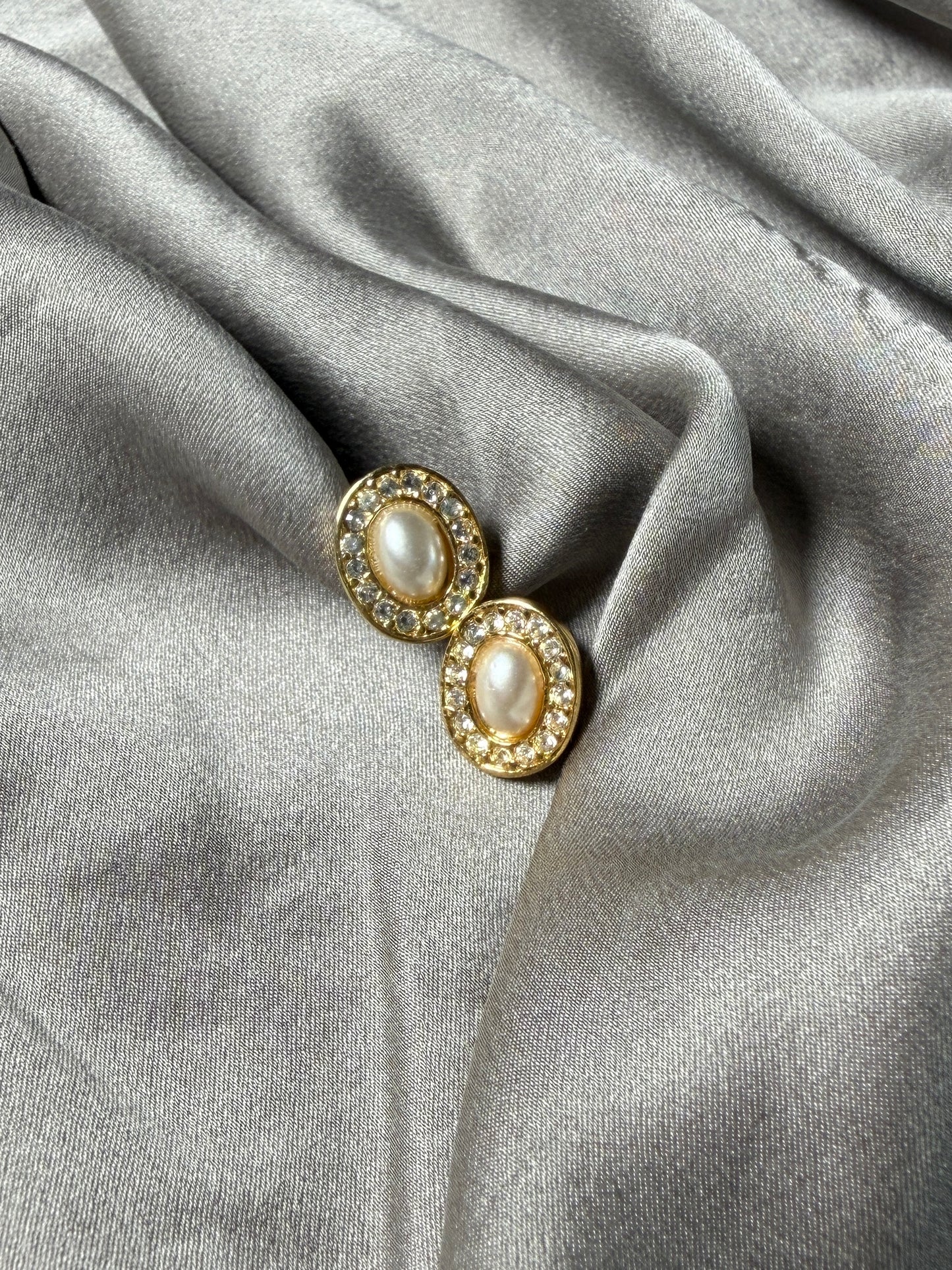 Classic vintage stud earrings featuring a faux pearl