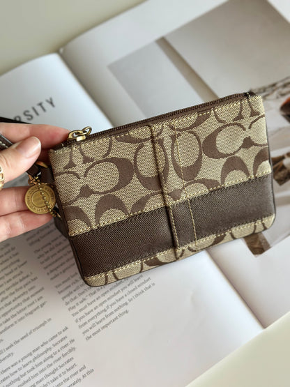 Iconic vintage brown Coach wristlet