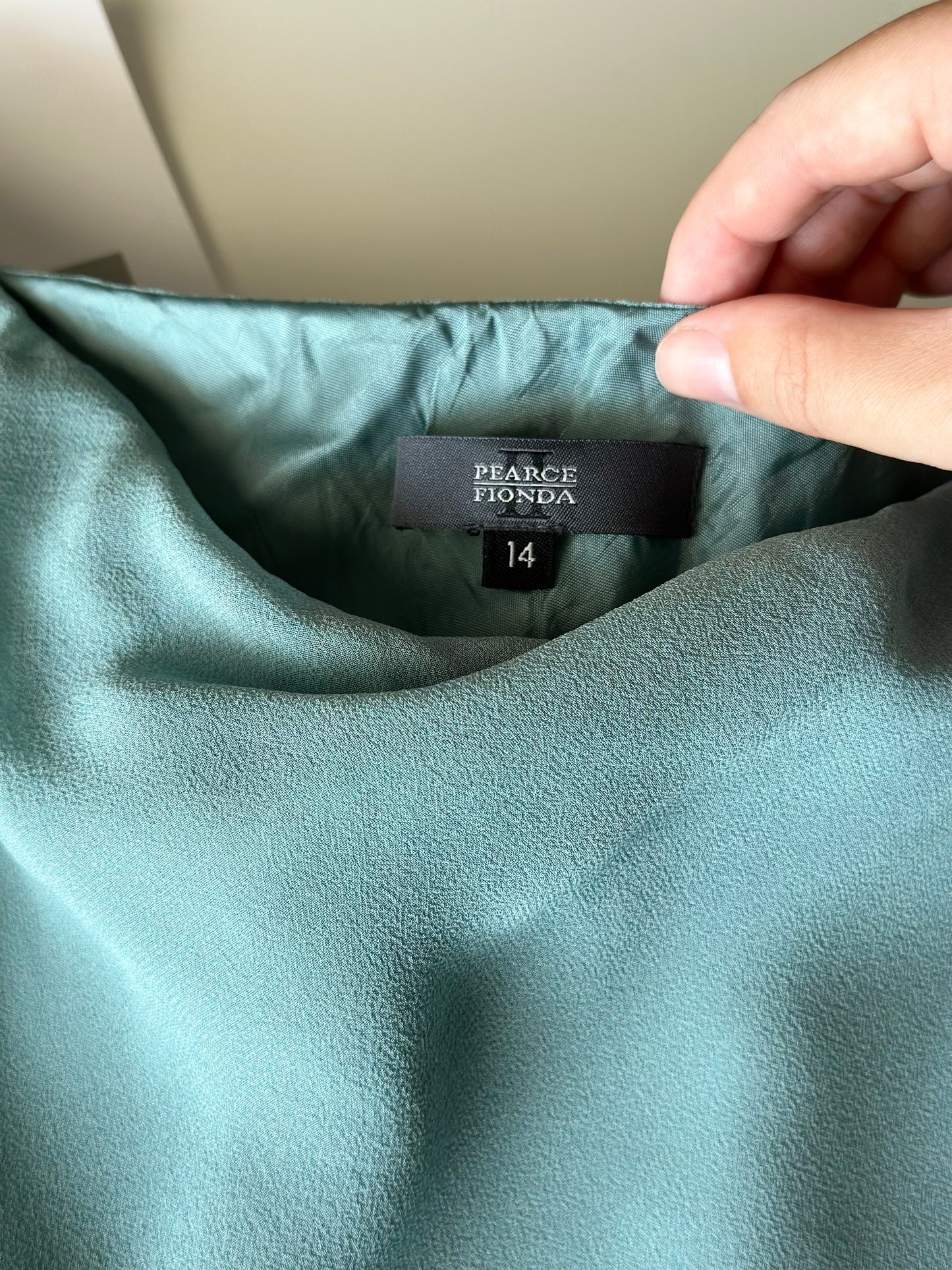 Asymmetrical silk turquoise skirt by Pearce Fionda brand